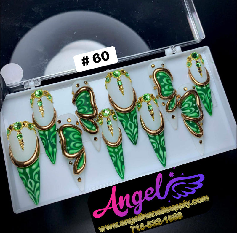 Set of green and gold butterfly-shaped earrings in a display case with 'Angel' branding.